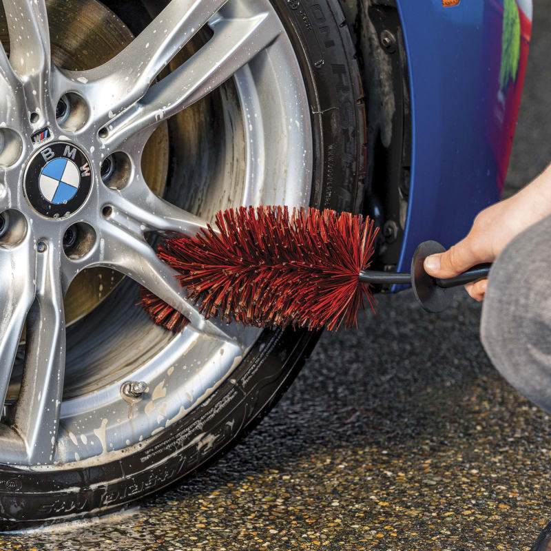 Wheel clearance brush cleaner