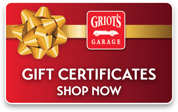 Red gift card with a gold ribbon and bow displaying the words 'Gift Certificates Shop Now' — the perfect holiday gift for car lovers from Griot's Garage.