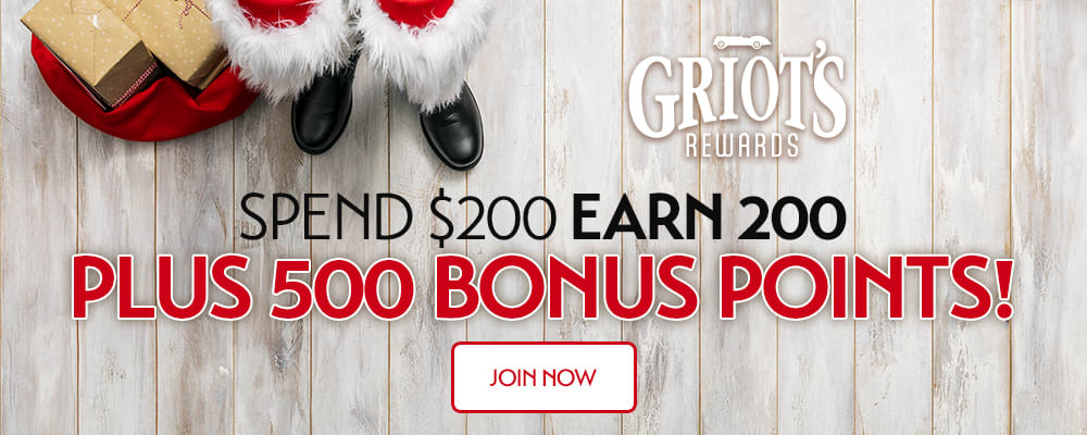 Santa's boots and a red sack of gifts beside text reading 'Spend $200 Earn 200 Plus 500 Bonus Points!' — festive Griot's Rewards promotion inviting shoppers to join now.