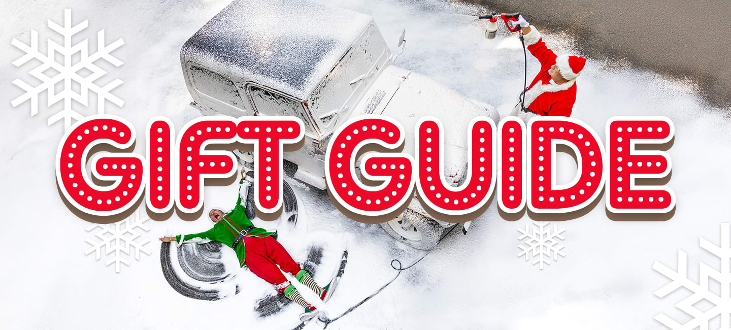 Holiday gift guide banner showing Santa and an elf covering a classic car in snow foam with the words ‘Gift Guide’ — perfect Christmas gift ideas for car lovers from Griot’s Garage.